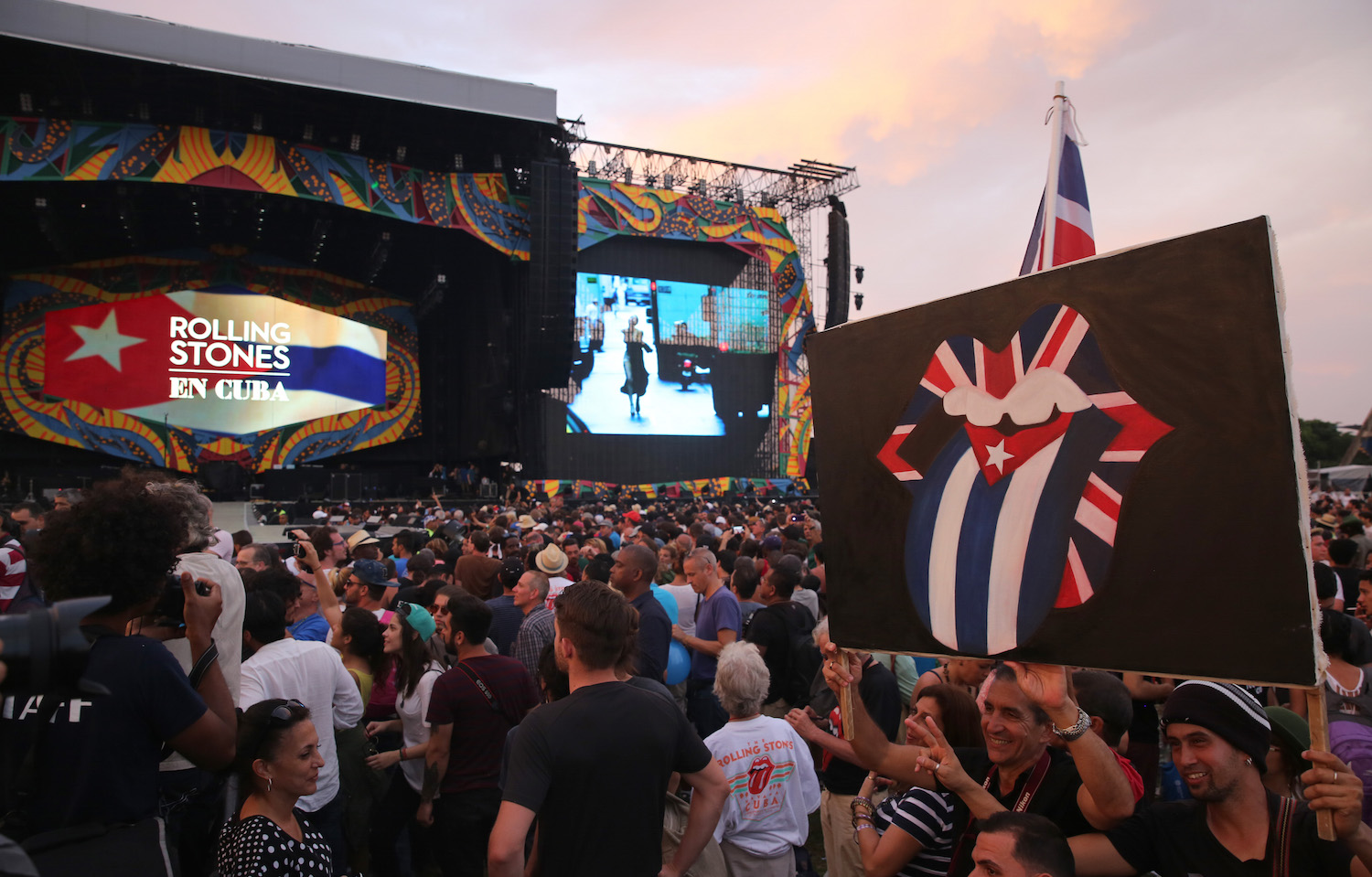 Fans wait for the start of the Rolling Stones concert in Havana, Cuba, Friday March 25, 2016. The Stones are performing in a free concert in Havana Friday, becoming the most famous act to play Cuba since its 1959 revolution. (AP Photo/Enric Marti)